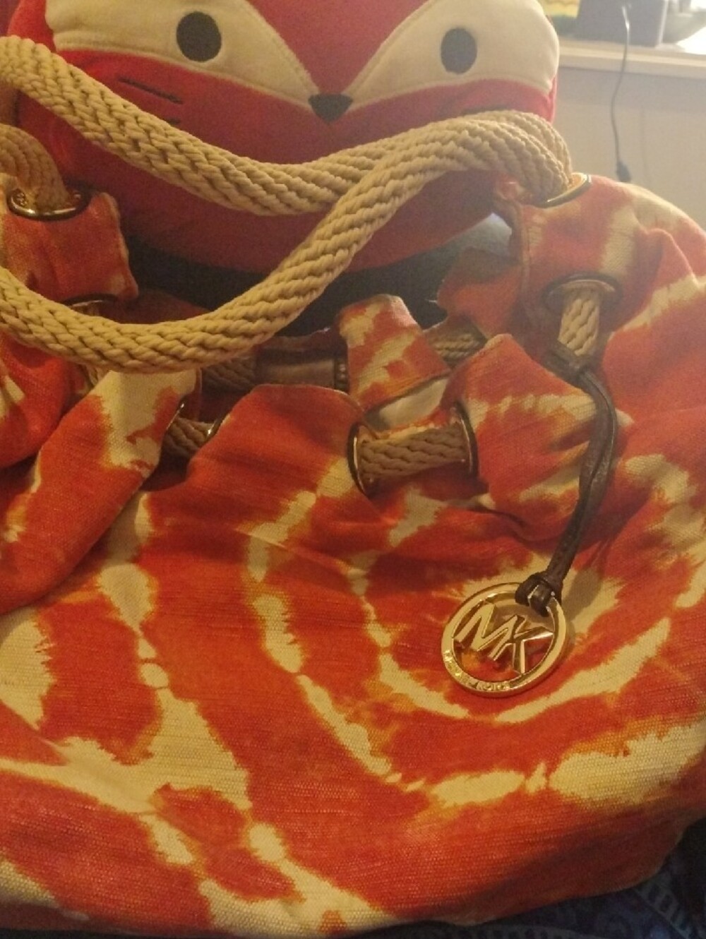 Woman's Michael Kors Gold MK Logo Charm on Orange and Cream Fabric